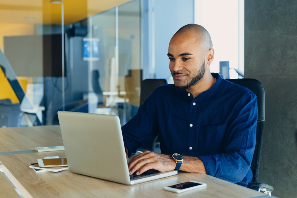 male professional on computer in purchasing process