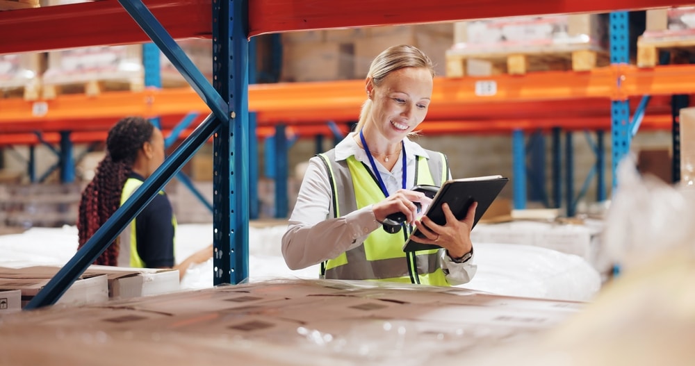 female warehouse employee counting inventory turnover